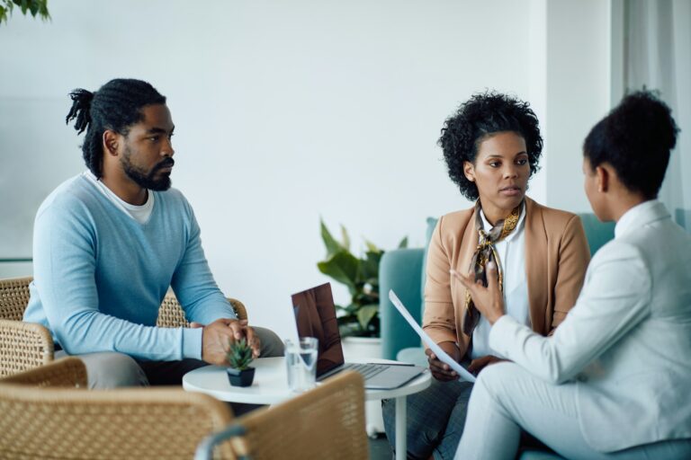 A confidential discussion between a client and a professional about Will Writing Services Dorking in a private office setting